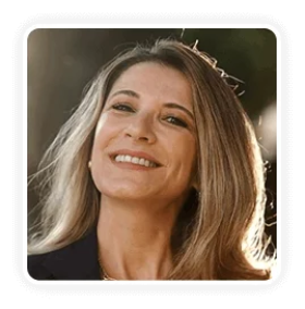 Smiling woman in her mid 40s sharing positive experience with improved bladder control and daily comfort